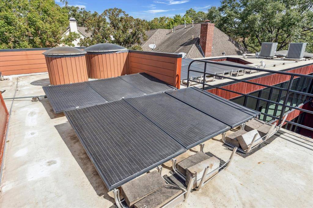 The rooftop deck.  Solar panels and recent roof (Fall 2023.)