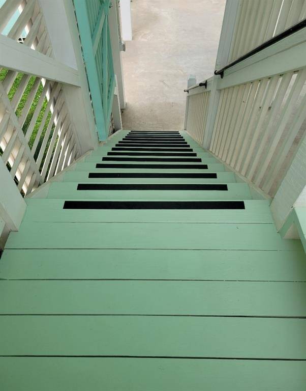 There is a 2nd layer of security in a locking door/gate on this great interior stairwell protected from the weather.