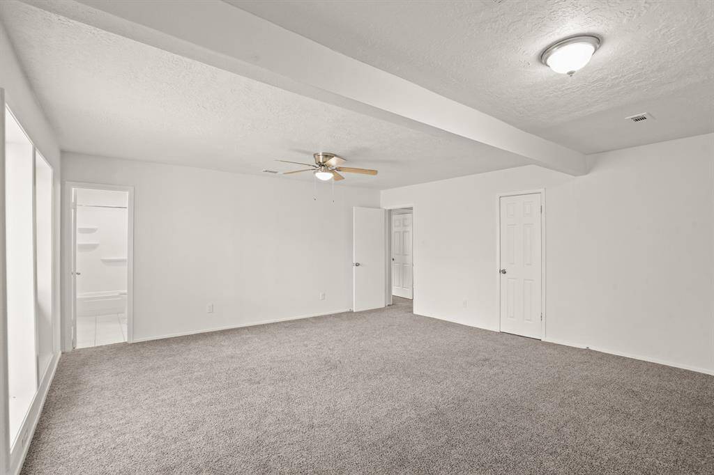 Large windows overlooking your private patio lets in beautiful natural light to create a warm, comfortable space to relax and unwind.