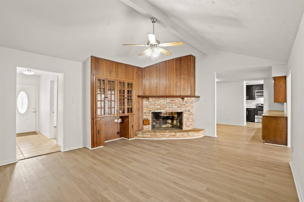 What better way to greet guests than with beautiful new flooring. This large living area with a comfortable and inviting feel offers the perfect setting for relaxation and socializing.