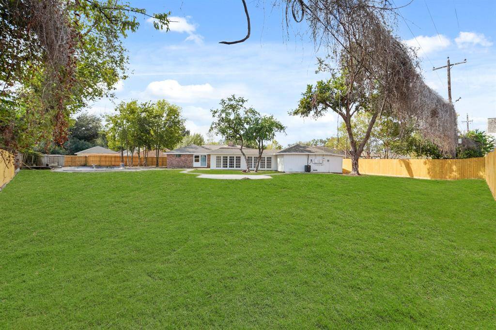 Huge, oversized backyard for all your family fun activities.  Plenty of green space for those four-legged friends too.