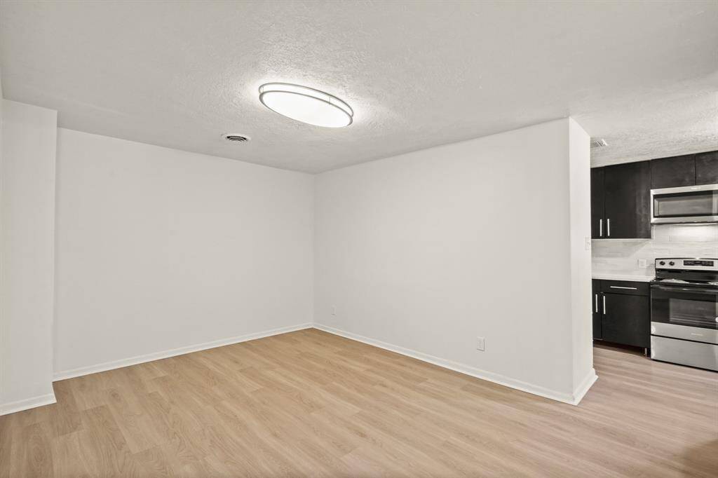 This spacious dining room is perfect for entertaining and will accommodate a large table for family and guests.