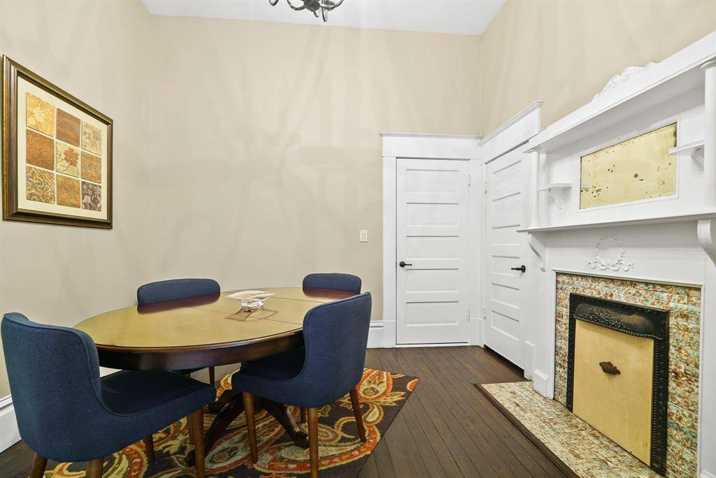 This second Office is grand in size and can easily accommodate a large desk, table, and/or sitting area. The grand fireplace boasts intricate tiling and a wrought iron framing, bringing in that old world charm.