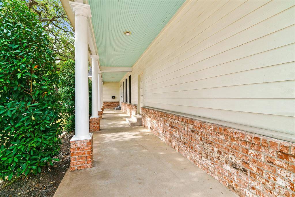 Who doesn’t love a sprawling Front Porch? This brick lined Porch boasts a tall beadboard ceiling and regal, white columns. Add rocking chairs to enhance the look and highlight the property’s southern charm.