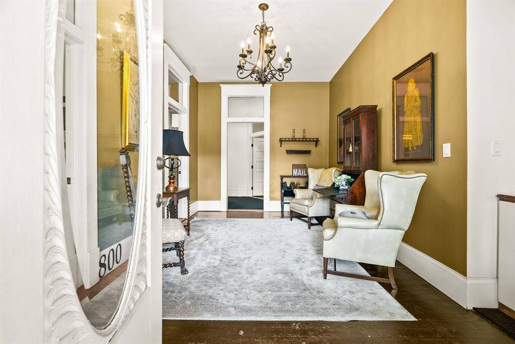 This grand and spacious Foyer is the warm and inviting welcome your guest’s desire. The original hardwood flooring, extra-wide baseboards, and elegant cased openings with transoms above are just some of the fine finishes that can only be found in an older building like this one.