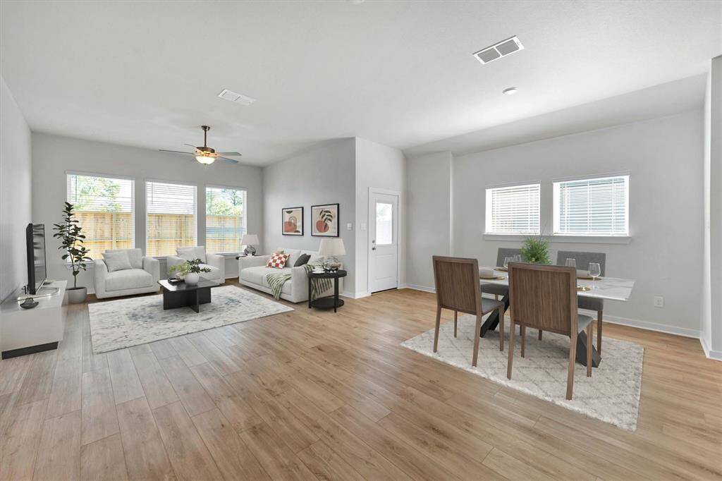 Virtually staged large living area and breakfast nook.