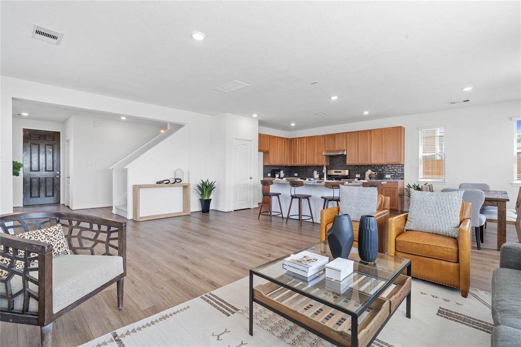 A beautiful view of this spacious open concept family room and kitchen!