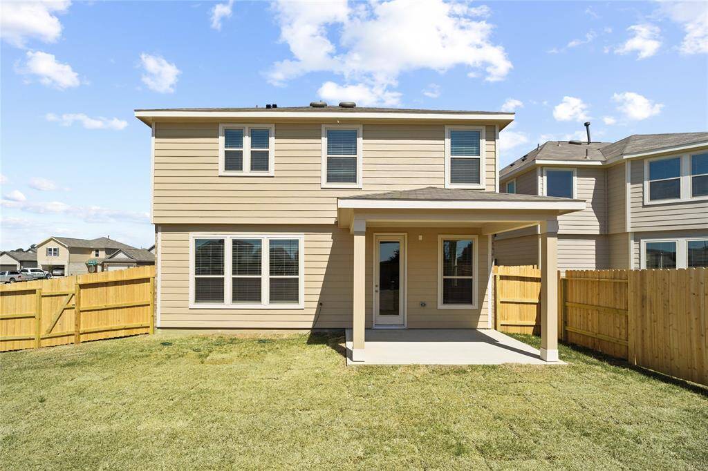 Come and see this spacious backyard with its beautiful covered patio. There is plenty of room for the kids to play and adults to relax!