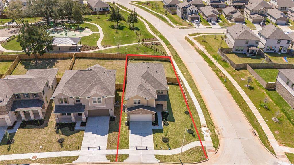 Amazing aerial shot of this gorgeous KB Home home situated on a large CORNER lot that backs up to the Community Park and Playground.
