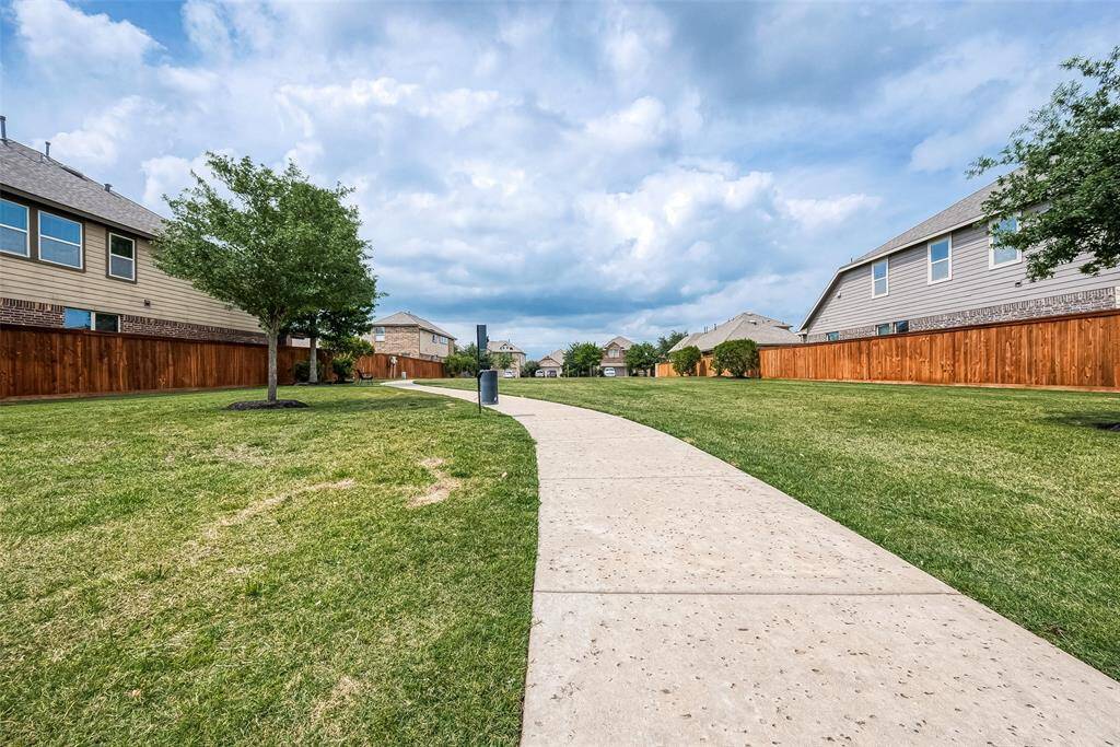 Discover tranquility with this charming greenbelt and walking trail, perfect for leisurely strolls right in your neighborhood.