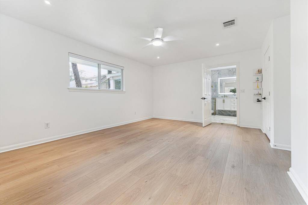 Primary bedroom with recessed lighting, fan and oversized closet for two