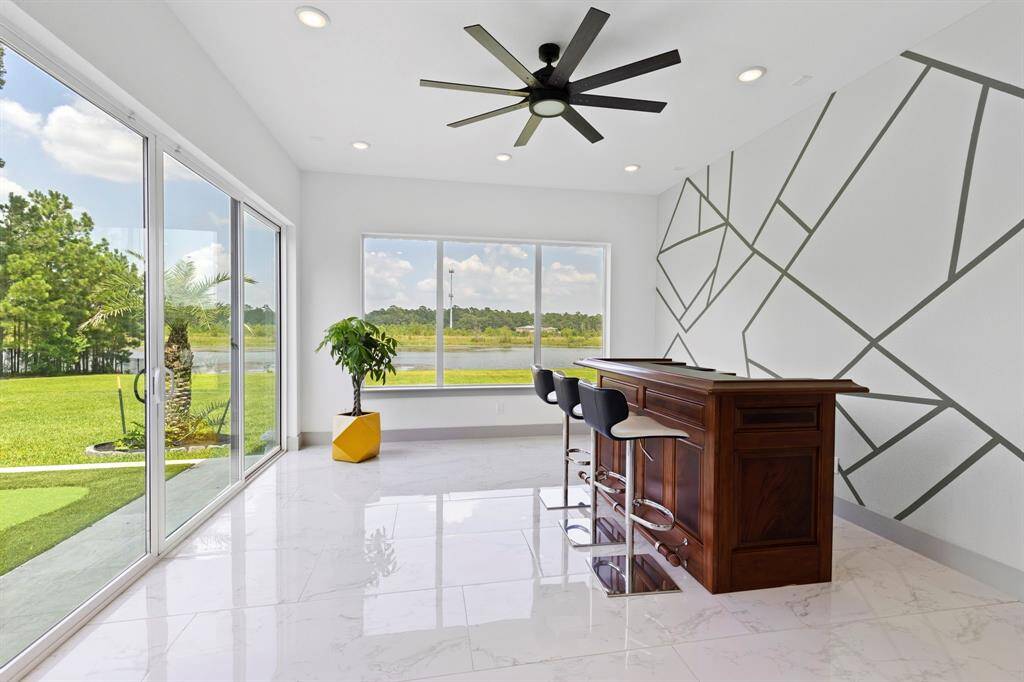 First floor flex room complete with sliding glass door extends entertaining venues. Ideal for a game room, study, additional sleeping or home gym.