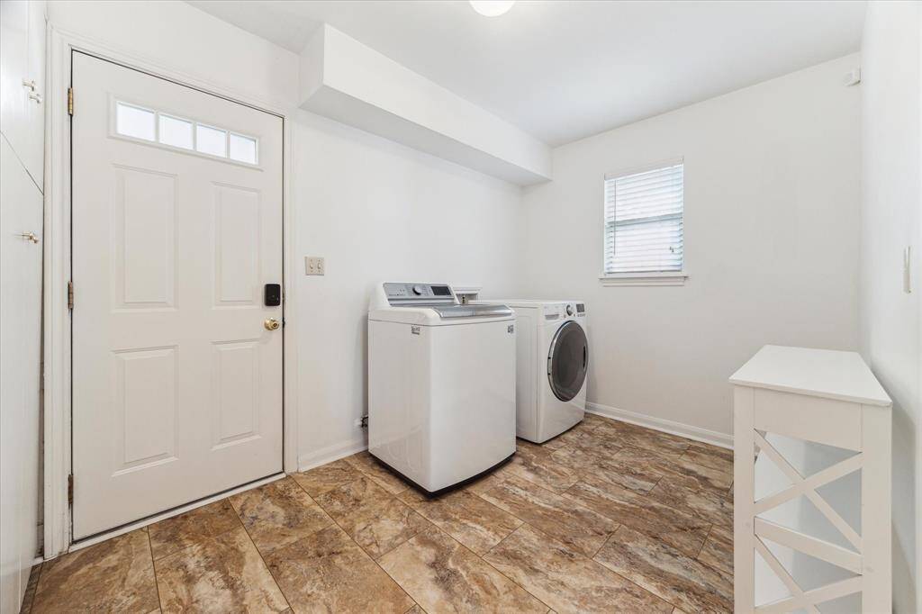 Spacious laundry room with so many options!