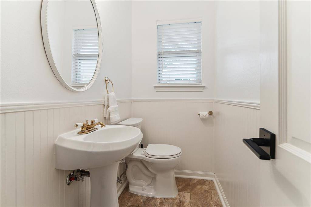 Powder bath in utility room area off of kitchen