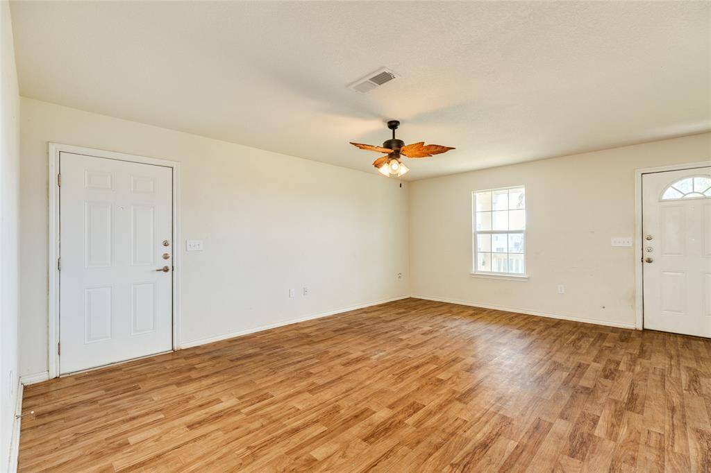 Entry door on right into living area. Door on left goes to storage room