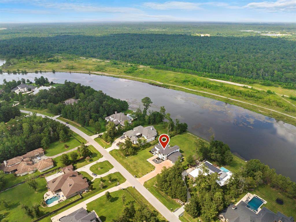 6219 Balsam Fir enjoys endless views of lush trees with the assurance that you will never have rear neighbors - protected land across the lake.