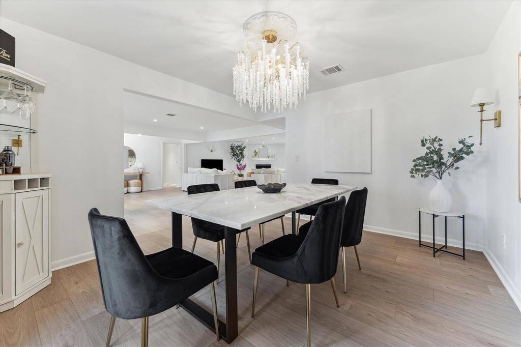 Alternative view of this stunning dining room looking into living room