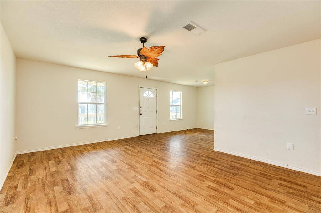 Living room and dining room on right of photo