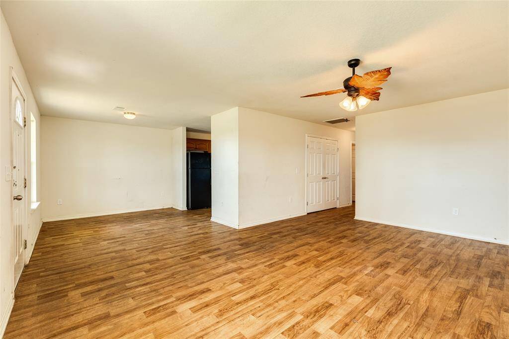 Living room, diving room, and hallway leading to bedrooms and bathrooms