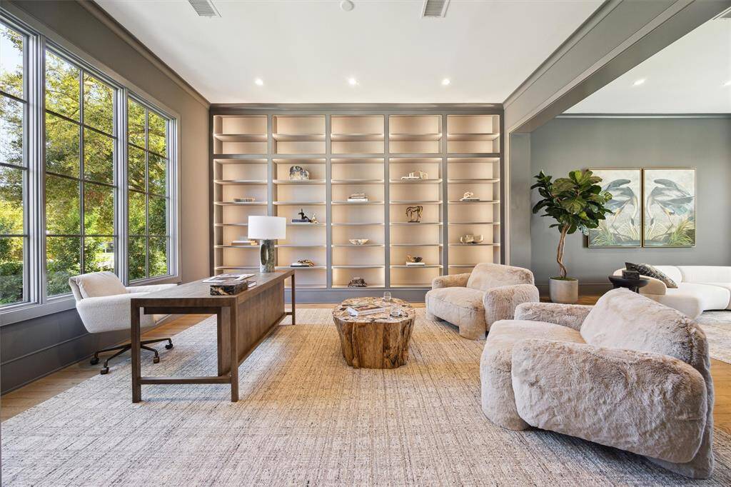 Office with custom built ins located at the front of the home.