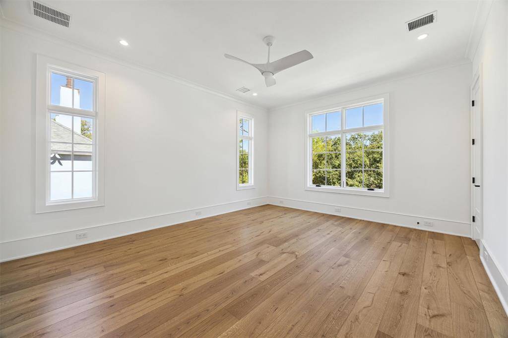 One of three secondary bedrooms on second floor