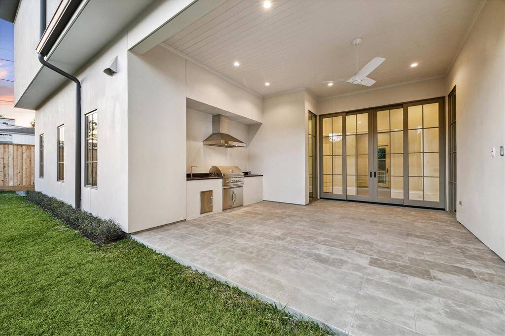Rear covered patio with outdoor grill