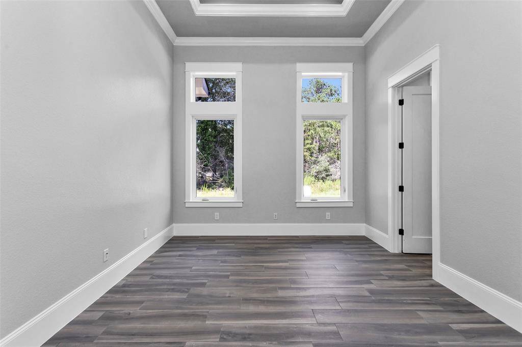 Bedroom #2. All Secondary Bedrooms are finished with casement windows with transoms, inset tray ceilings, incredible moldings and millwork, "wood" tile flooring, 2 locations of shielded CAT6A (Ethernet/Data) and shielded coaxial (TV) cables and En Suite Bathrooms.