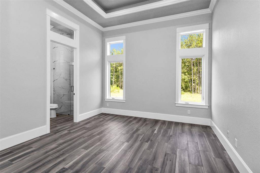 Bedroom #5. All Secondary Bedrooms are finished with casement windows with transoms, inset tray ceilings, incredible moldings and millwork, "wood" tile flooring, 2 locations of shielded CAT6A (Ethernet/Data) and shielded coaxial (TV) cables and En Suite Bathrooms.