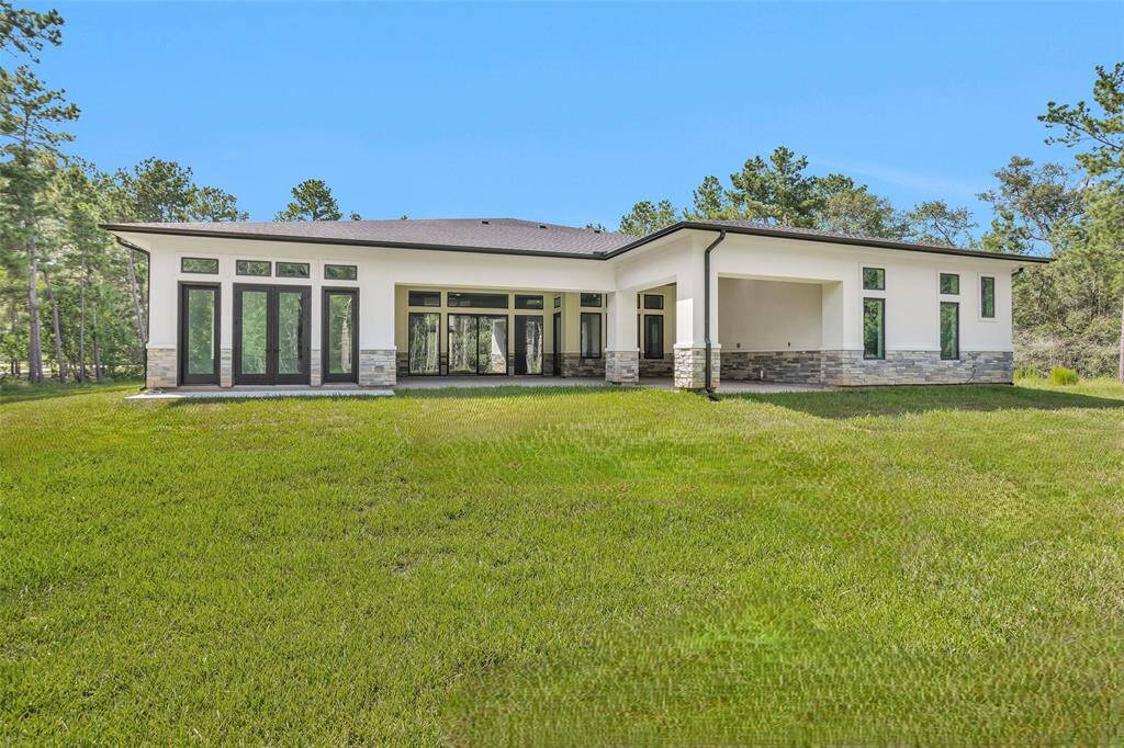 Large frameless glass double doors to the Primary Bedroom and L-shaped Covered Patio offers amazing indoor/outdoor living and yard access. 2 ethernet/data connections for power over ethernet (POE) security cameras on each side of the home.
