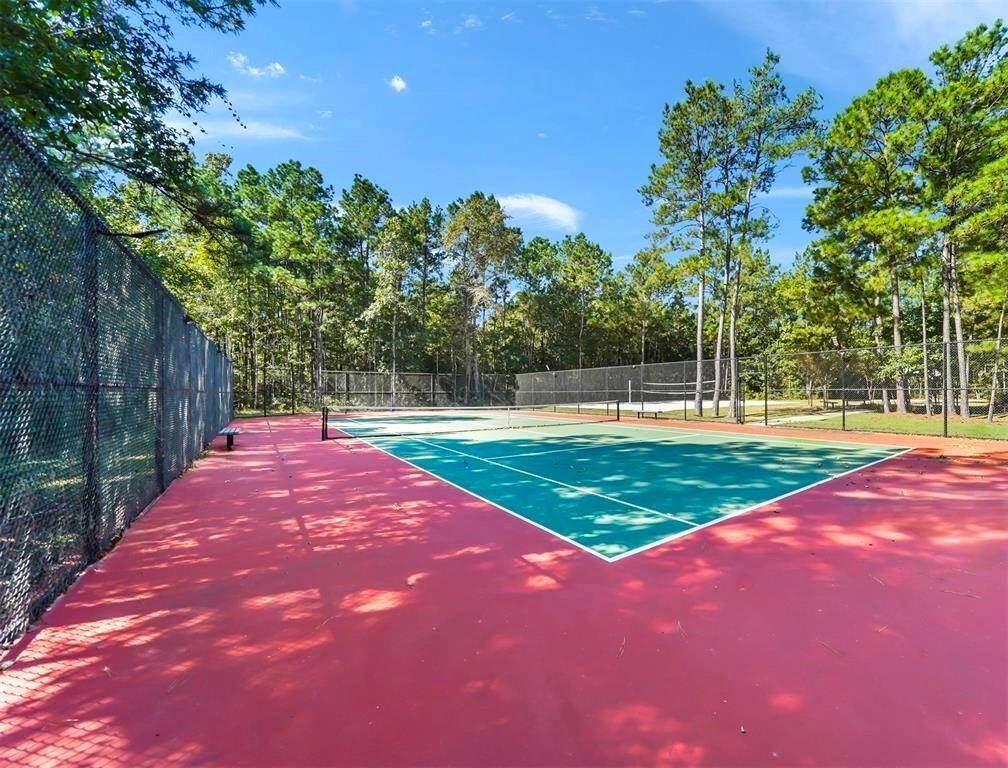 Keep active on the community tennis courts on the 8-mile hiking trail.