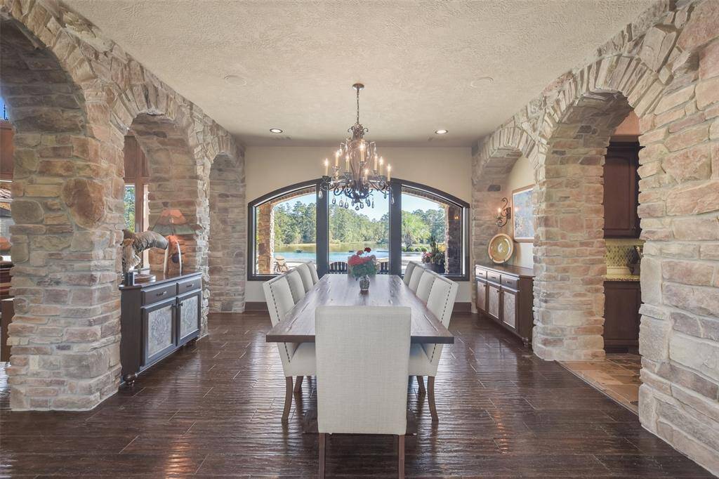 The spacious dining room offers views of the living room through stone peek-a-boo archways