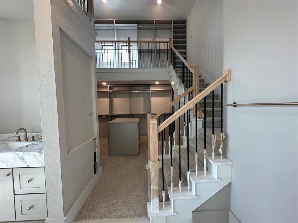View of this spacious Kitchen underway opening to the Butler's Pantry, Breakfast Area and fabulous two-story Family Room just beyond it.