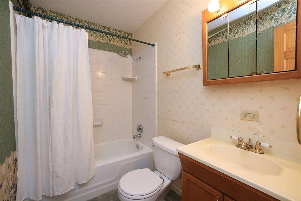 The home's 2nd Full bath includes a tub/shower combo, vanity for added storage, and medicine cabinet.