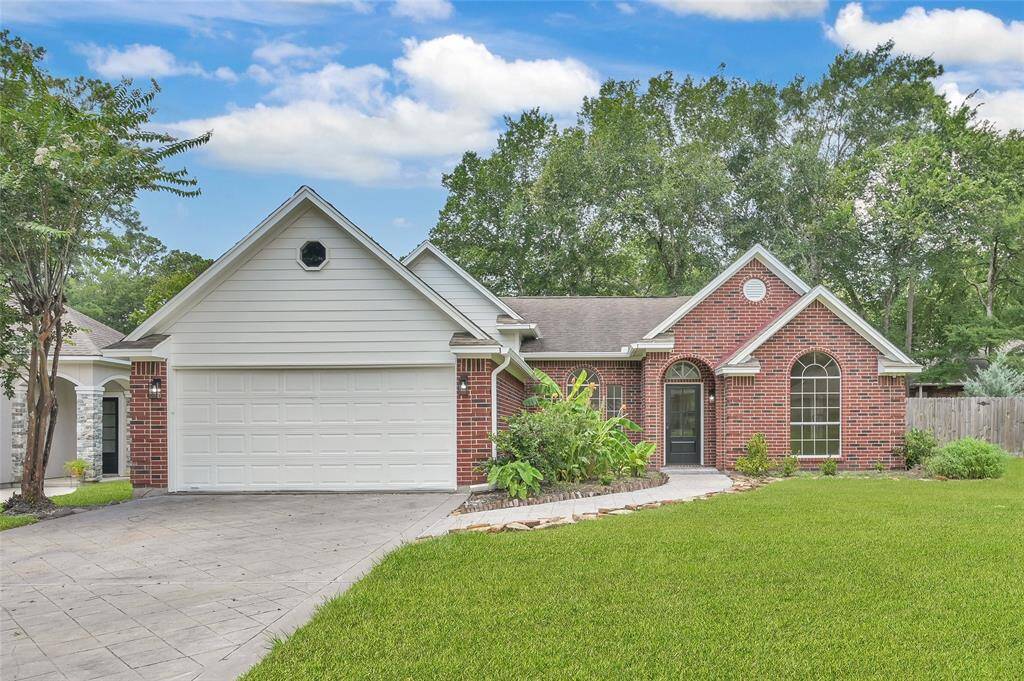 This photo captures the impressive curb appeal of this immaculate property, showcasing its beautifully manicured lawn and mature trees. New Roof has been added to this beautiful home!