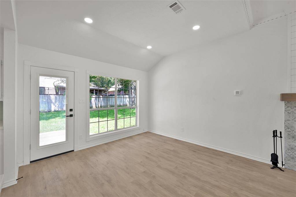 Experience elegance and sophistication in this beautifully remodeled formal dining room, seamlessly connected to the spacious living room, making it perfect for both intimate dinners and grand gatherings and entertaining!