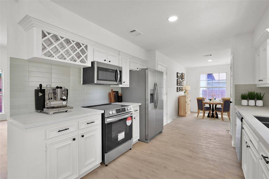 This kitchen has a built-in wine rack for your enjoyment!