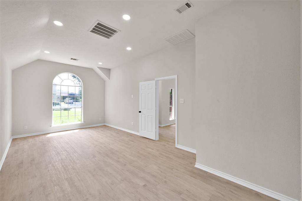 Discover your personal haven in this exquisitely remodeled primary/master retreat, where sophistication and comfort converge. This expansive sanctuary features soaring ceilings that enhance the sense of space and grandeur, creating an open and airy atmosphere.
