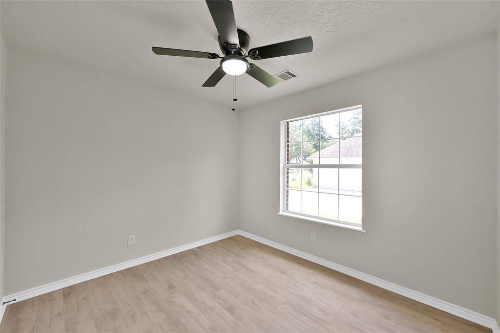 Bedroom #2 features new ceiling fan and LED lights with new LPV flooring throughout!