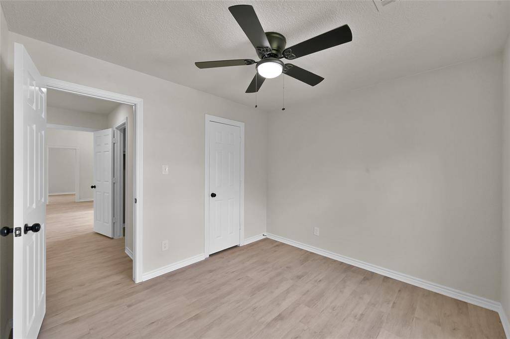 Throughout the entire residence, the newly installed Luxury Vinyl Plank (LVP) flooring exudes elegance and durability. The upgraded baseboards provide a modern sophistication.