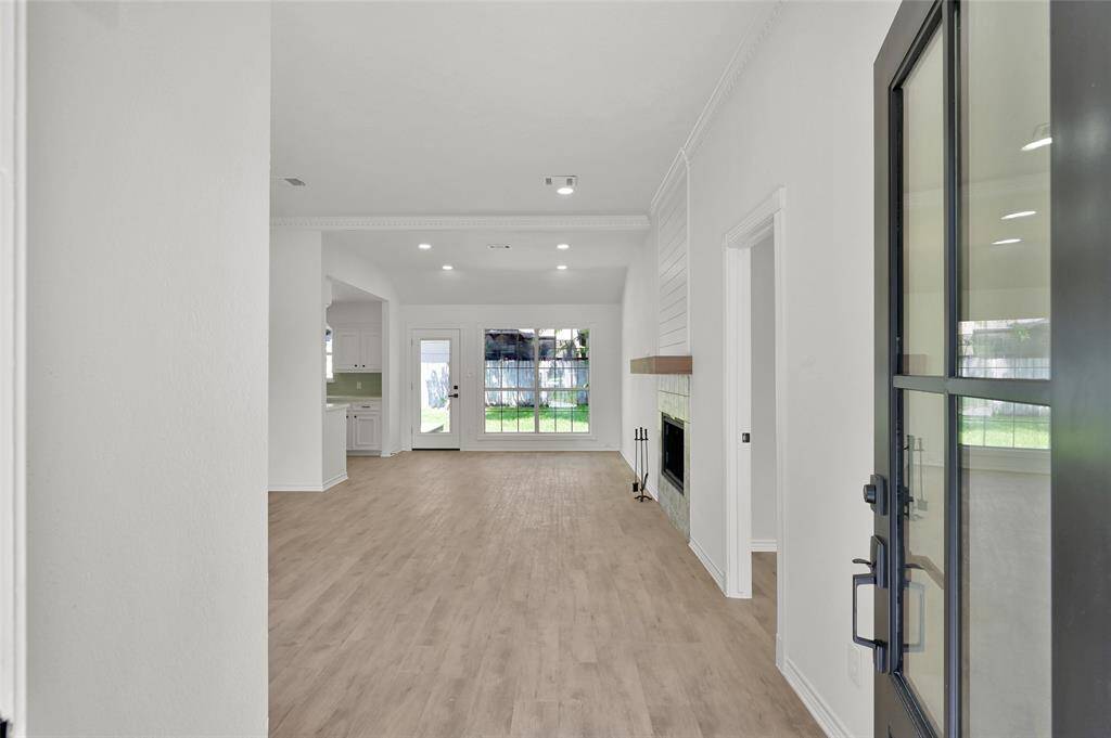 Upon entering, you are greeting by the stunning LVP flooring that stretches across the entire home, providing both durability and a sophisticated look!