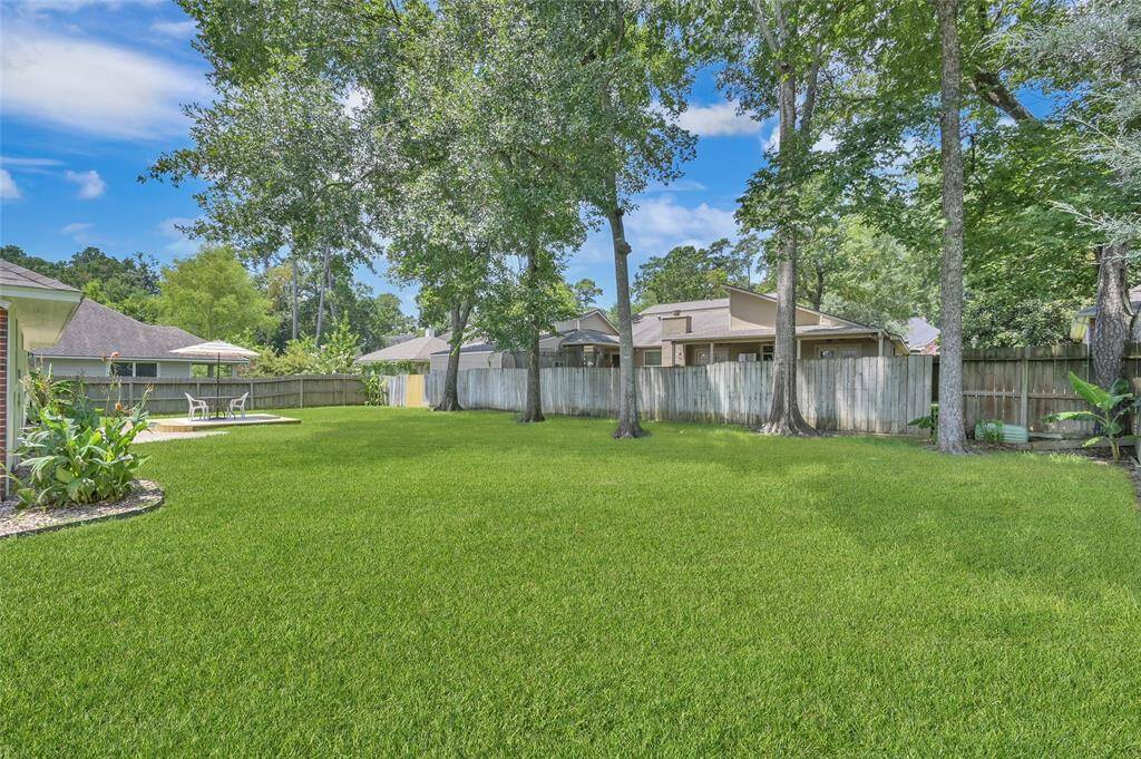Outside, enjoy the beautifully landscaped backyard with a large stamped concrete patio and new wood deck, perfect for summer barbecues and outdoor gatherings.