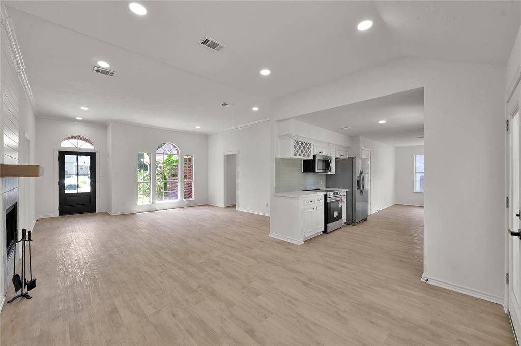 Step into the bright and airy living room with adjoining formal dining room!