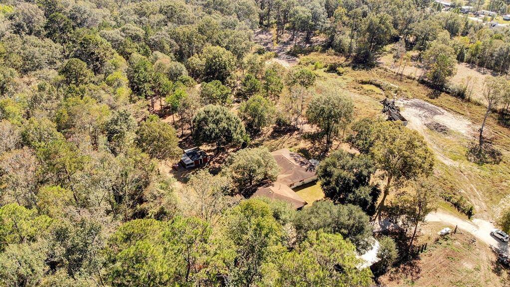 ariel view of home and 3 uncleared acres.