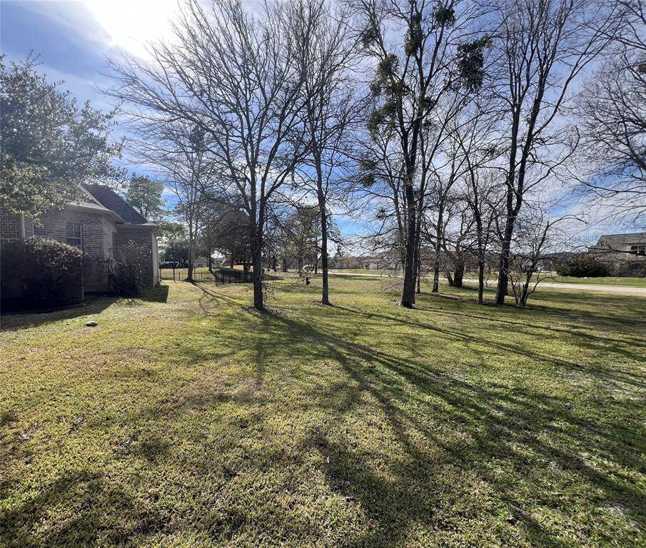 Left side next to neighbor's house