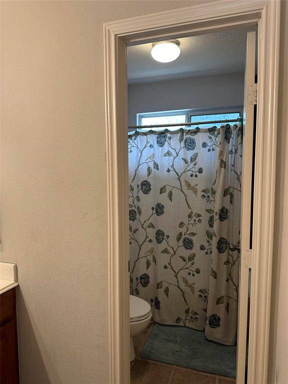 Separate toilet/tub area for upstairs bathroom