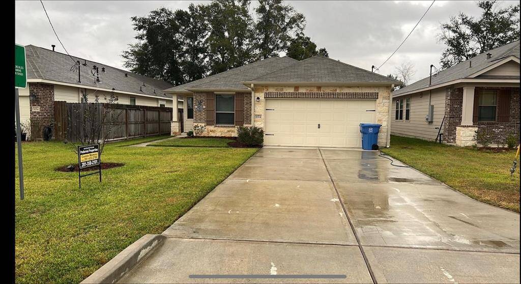 Single -one story home. two car garage and a neatly landscaped.
