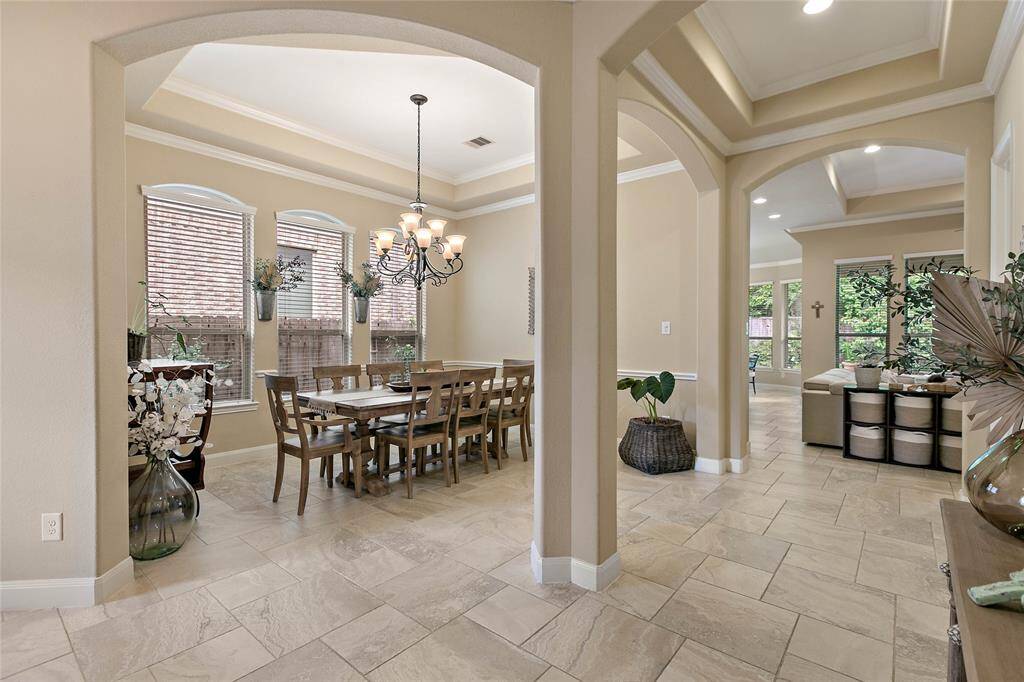 The perfect chandelier crowns the formal dining room.