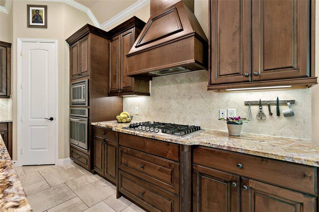 Lovely custom cabinetry accent this beautiful kitchen.