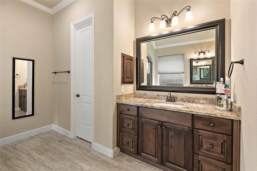 Beautiful woodwork continues in the ensuite bathroom for the primary bedroom.