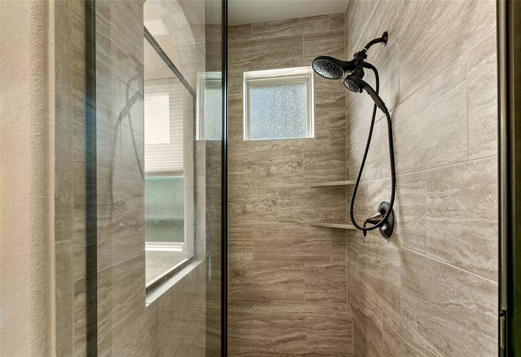 Beautiful tile work in this elegant shower.